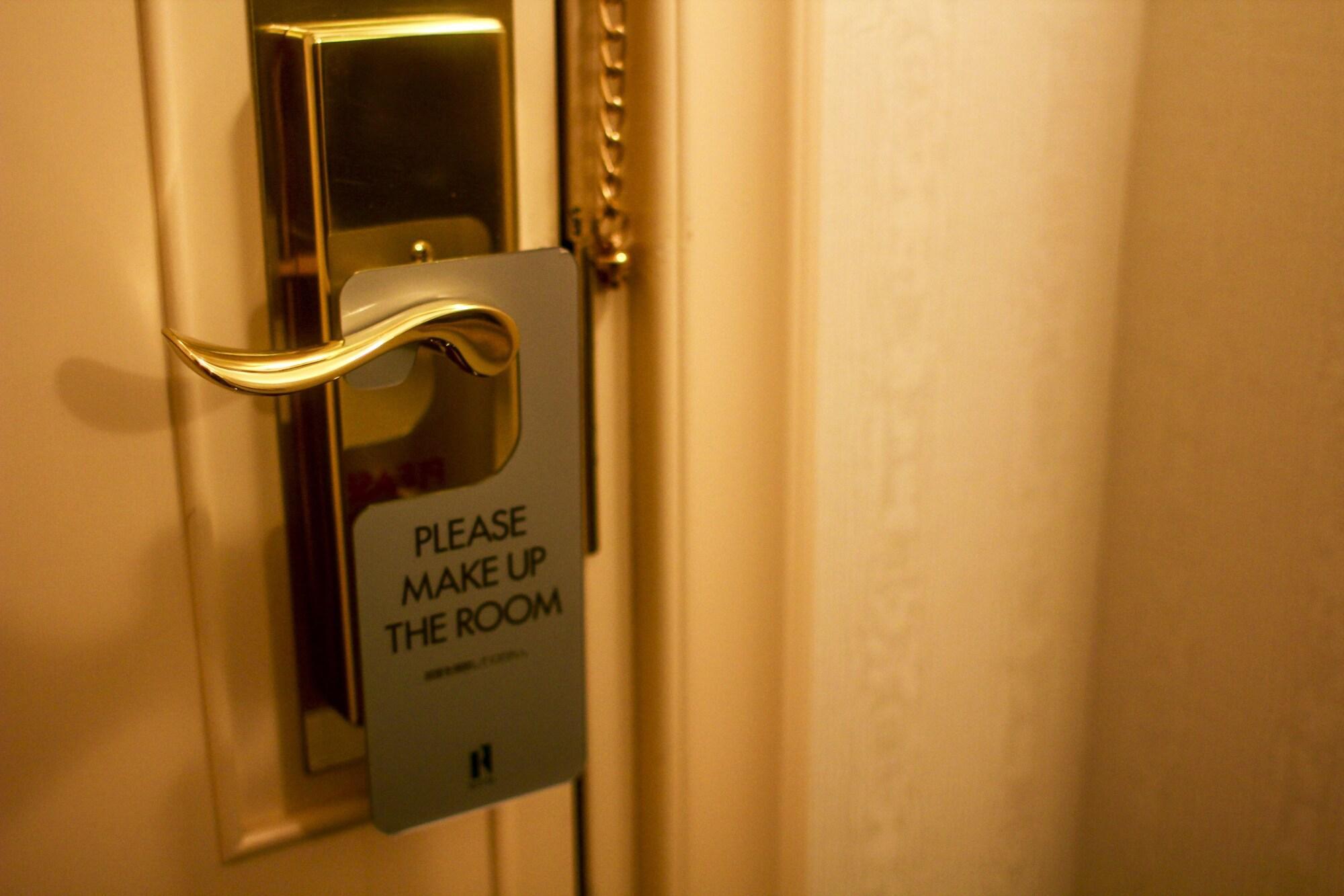 로이톤 삿포로 호텔 삿포로 시 외부 사진 A door sign requesting a maid service